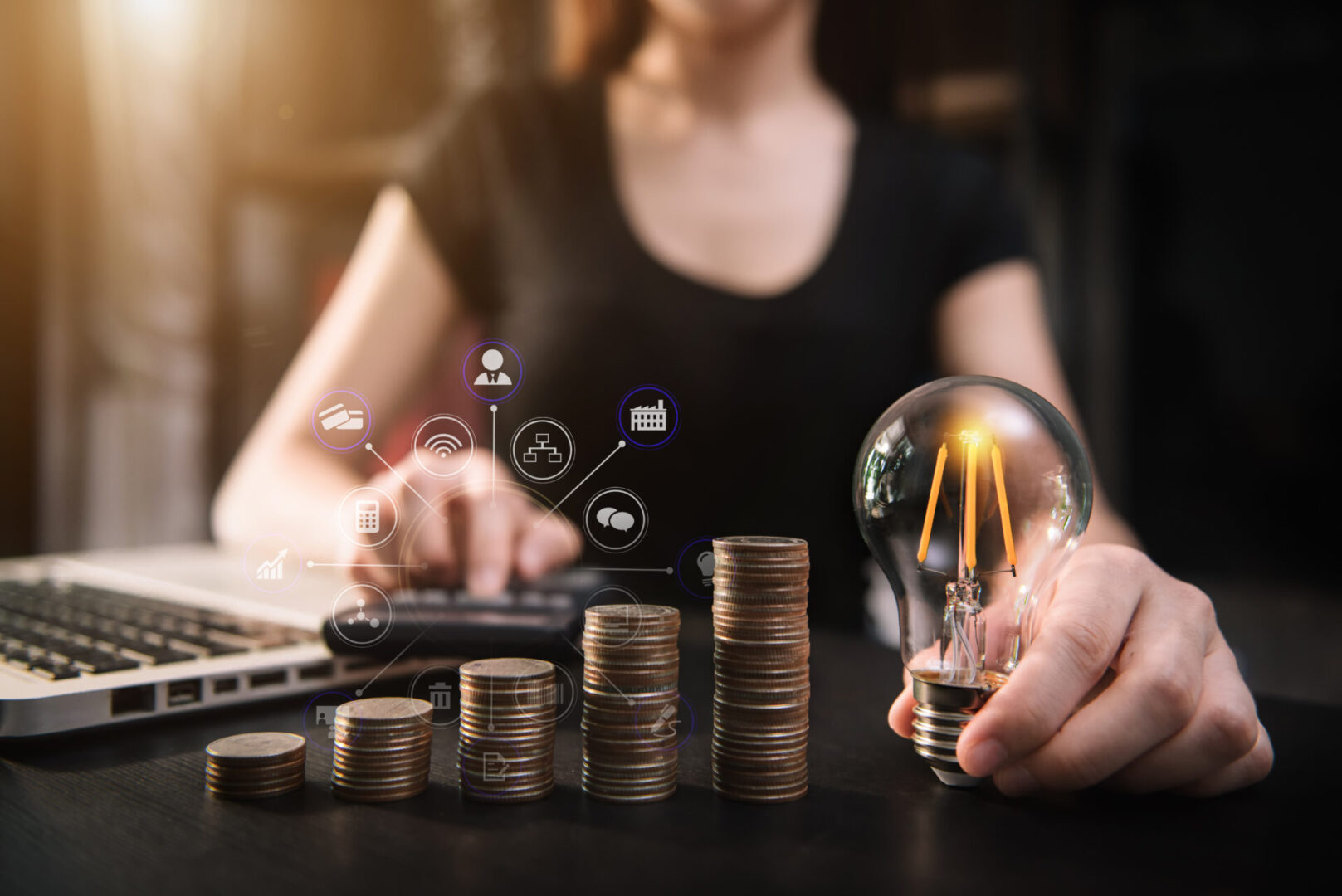 A woman is holding an electric light and money