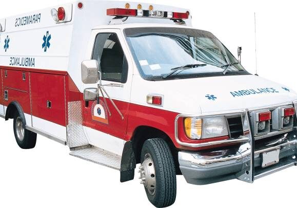 A red and white ambulance with its door open.